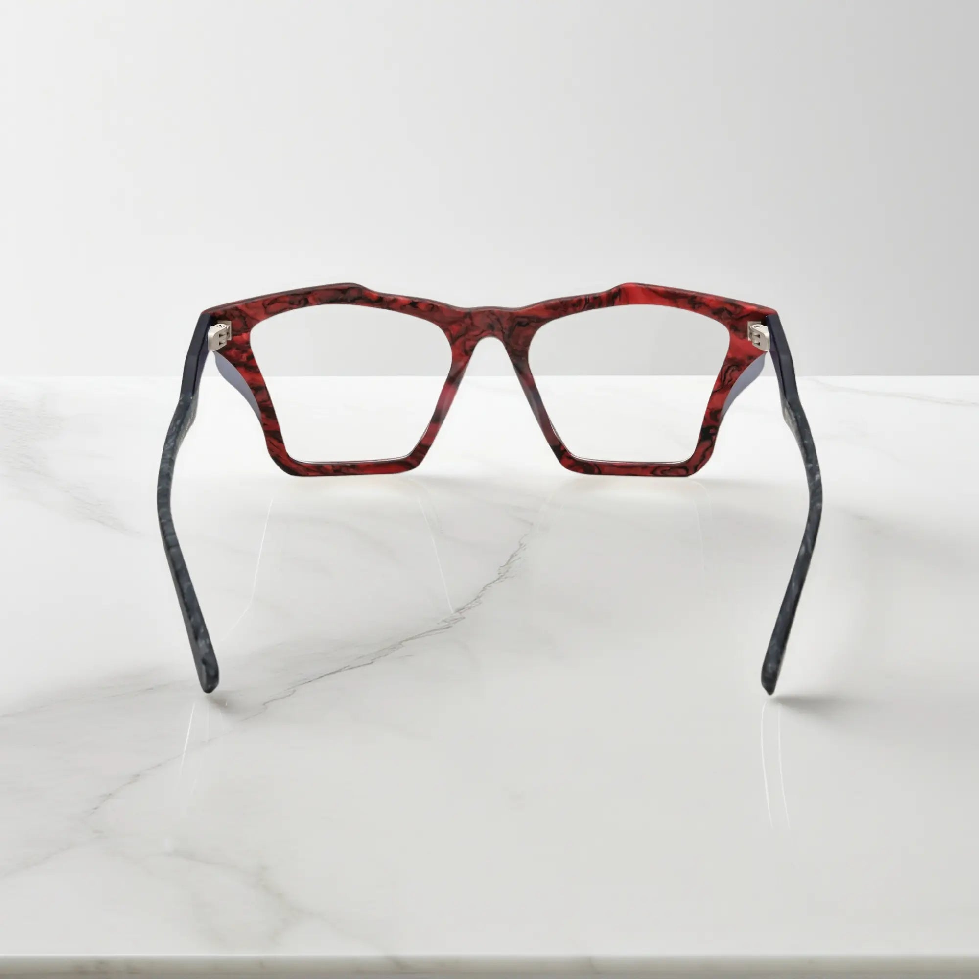 Rear view of VoyueLens™ Crimson Nebula frame, displaying matte crimson red with cosmic black accents from the inner frame and hinge area.